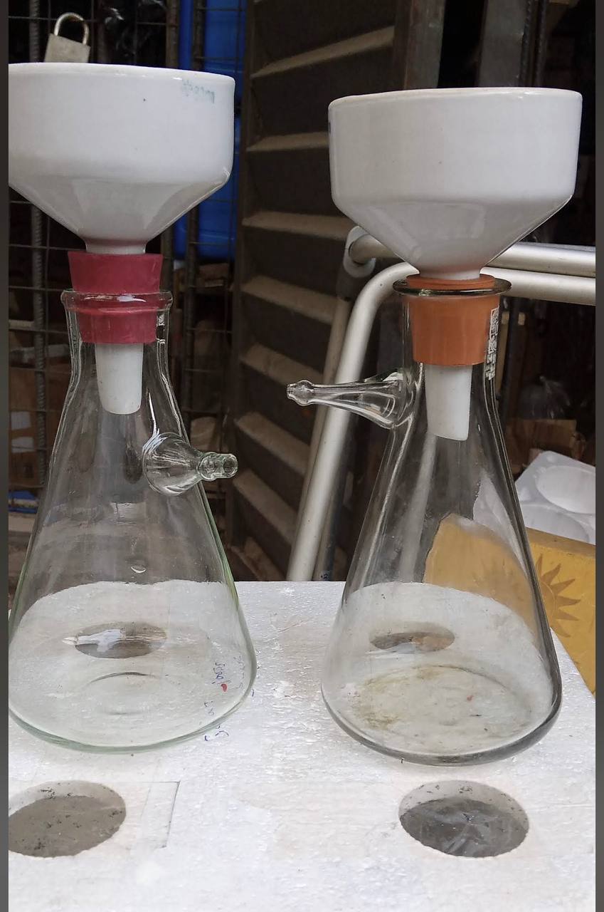 Porcelain Büchner funnels fitted on glass filtering flasks