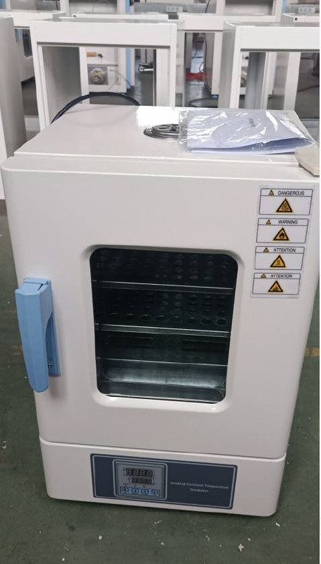 Laboratory incubator with glass door and shelves