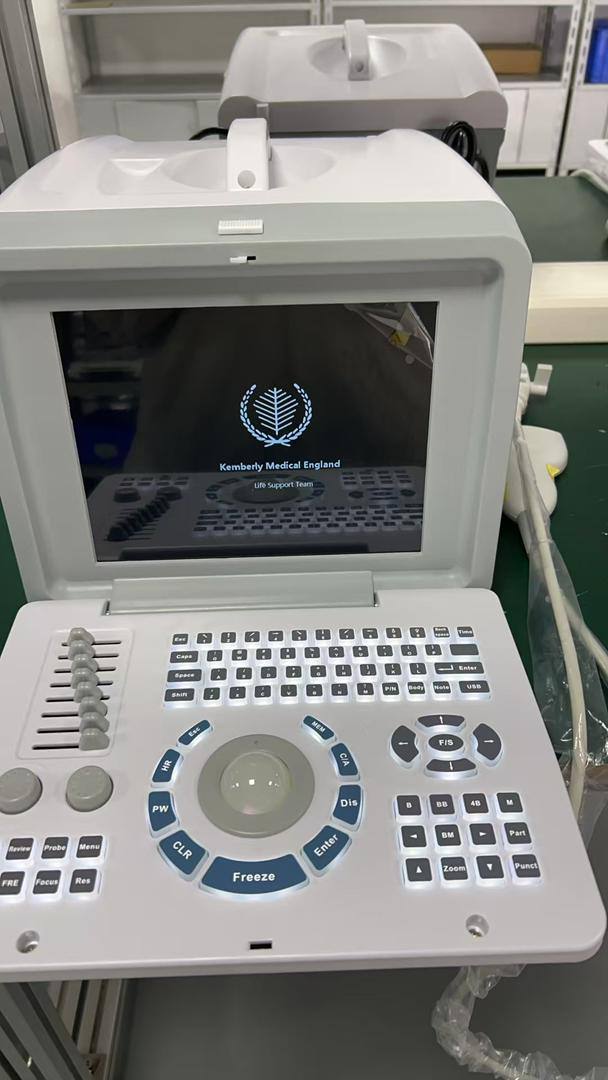 Portable ultrasound scanning machine with keyboard and trackball